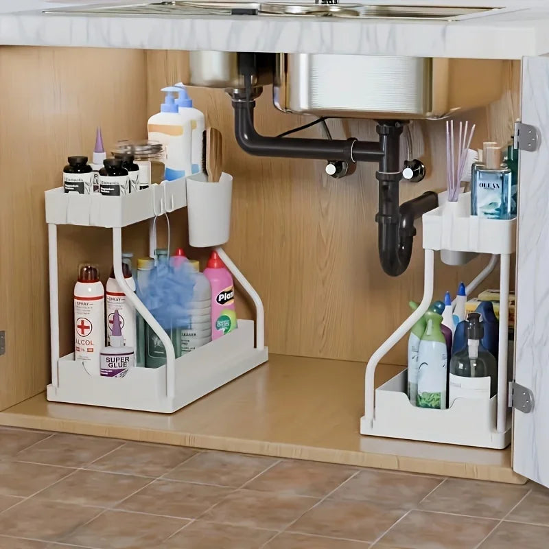 Space-saving 2-tier under-sink organizer set; two white pull-out storage units under the sink.